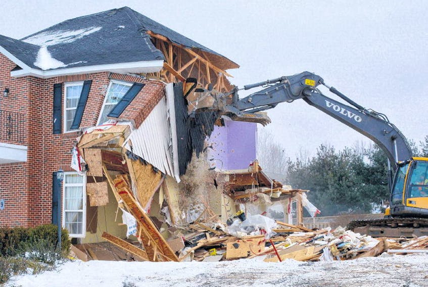 Pieces of the home on Mountain View Drive in Falmouth fall away from the structure as the excavator demolishes the building Tuesday.
COLIN CHISHOLM • HANTS JOURNAL