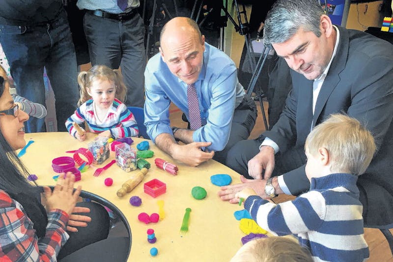 Premier Stephen McNeil and Jean-Yves Duclos, federal minister of families, children and social development, join children at St. Joseph’s Children Centre in Bedford and their teacher, April Burt, before a daycare funding announcement Wednesday. - Francis Campbell