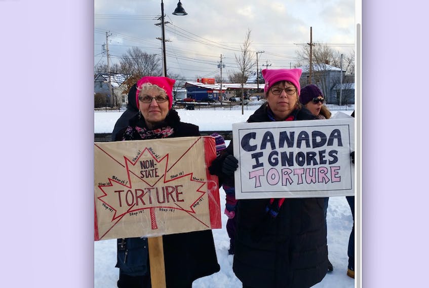 Jeanne Sarson, left, and Linda MacDonald were raising awareness about non-state torture when they took part in the women’s march in Truro this month.