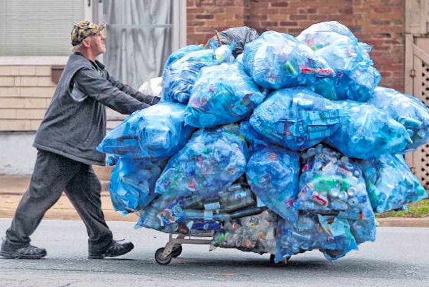 Wray Hart steers his collection of bottles and cans along Inglis Street, as he heads toward a nearby recycling depot in Halifax in 2012. Hart was struck and killed by a car in Halifax on Saturday.
TIM KROCHAK • FILE
