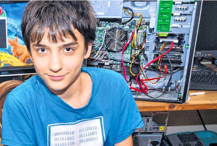 Eleven-year-old Jonas Tkacz of Antigonish is pictured hard at work mining Bitcoin.
-AARON BESWICK