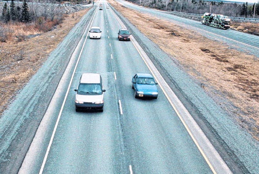 Cars travel along Highway 102 near Halifax Stanfield international airport. The law requiring drivers to immediately slow down to 60 km/h when passing a pulled-over emergency vehicle with its emergency lights flashing is unrealistic, says an engineering professor who is an expert in highway safety. CHRISTIAN LAFORCE • FILE