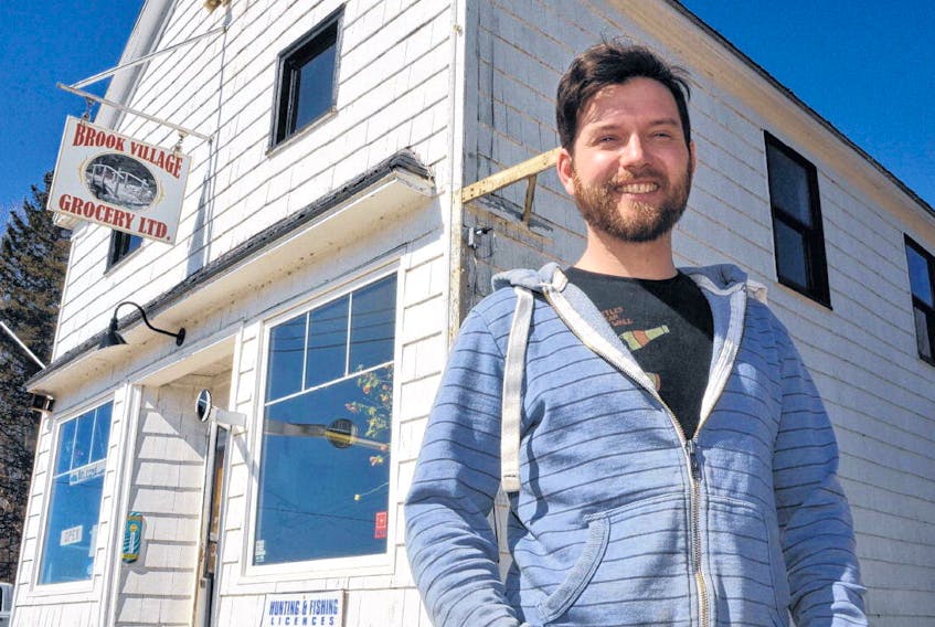 Timothy Burns stands outside Brook Village Grocery Ltd., which has operated in the Cape Breton community for over a century and a half. AARON BESWICK • THE CHRONICLE HERALD