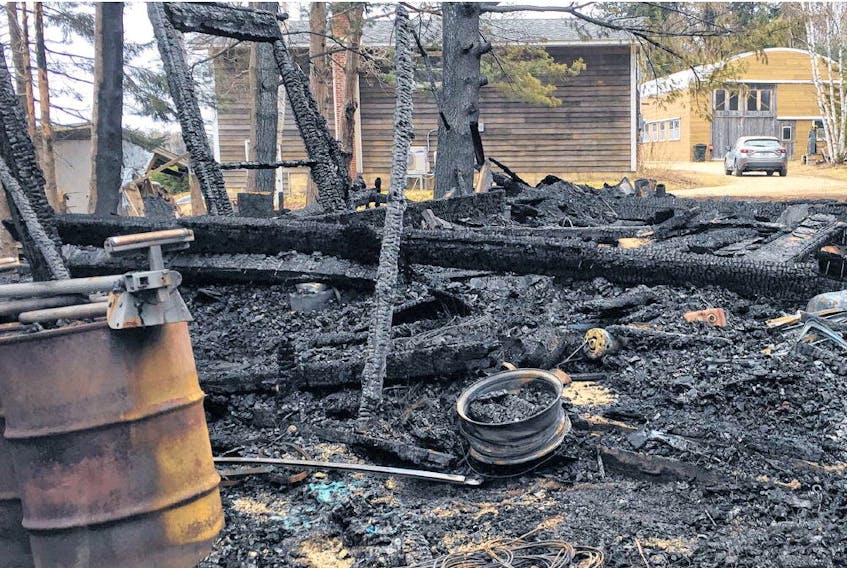 A Simms Settlement man allegedly burned down this Stanford Lake Road garage in Chester early Sunday morning during a crime spree culminating in 21 charges being laid against the man. ANDREW RANKIN • THE CHRONICLE HERALD