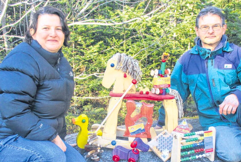 Elke Uribe, left, and Ray Syvitski, owners of the Toy Maker of Lunenburg, make wooden toys, games and brain teasers to inspire young imaginations. ALLISON LAWLOR