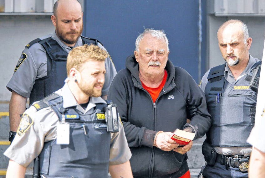 Joseph Noel Landry, 68, is led out of Dartmouth provincial court following a court appearance Wednesday. Landry is facing a second-degree murder charge in the death of Darren Clyde Reid in a Portland Street apartment Monday night.
TIM KROCHAK • THE CHRONICLE HERALD