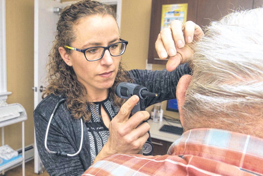 Dr. Barbara O’Neil uses an otoscope to check a patient’s ear at her Kennetcook practice on Monday morning.
RYAN TAPLIN • THE CHRONICLE HERALD