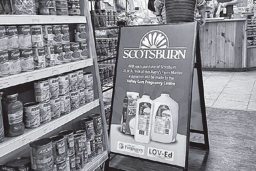 A Scotsburn Dairy sign announces that with every purchase of select Scotsburn milk purchases a donation wil be made to Valley Care Pregnancy Centre. FACEBOOK