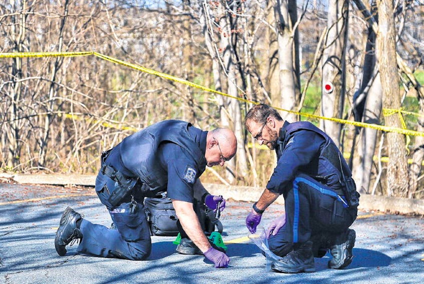Police search at the scene of an investigation just off Joseph Howe Drive near the Ashburn golf course Tuesday morning.
TIM KROCHAK • THE CHRONICLE HERALD