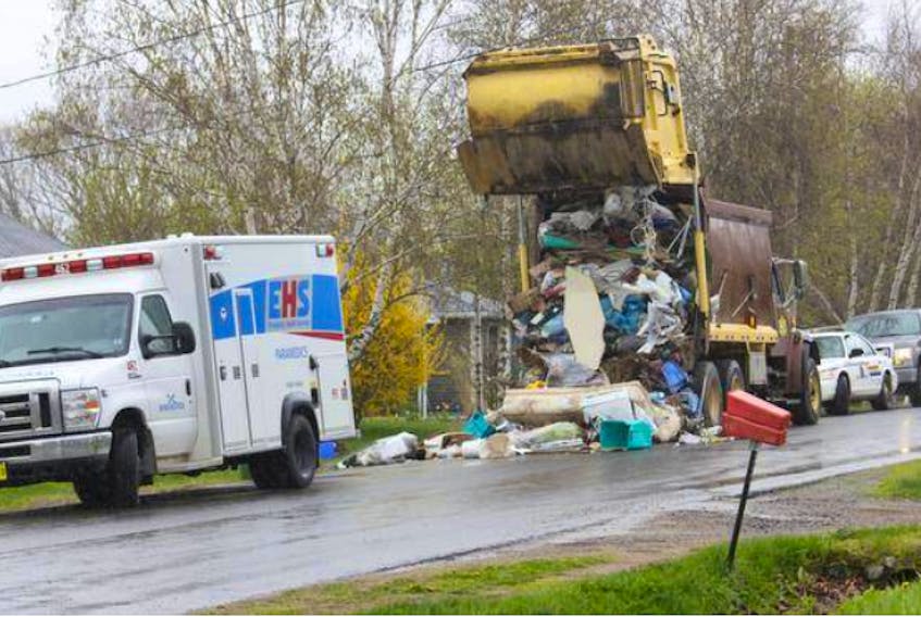 A young man died as a result of injuries sustained while working on this garbage truck in Port Williams May 10.