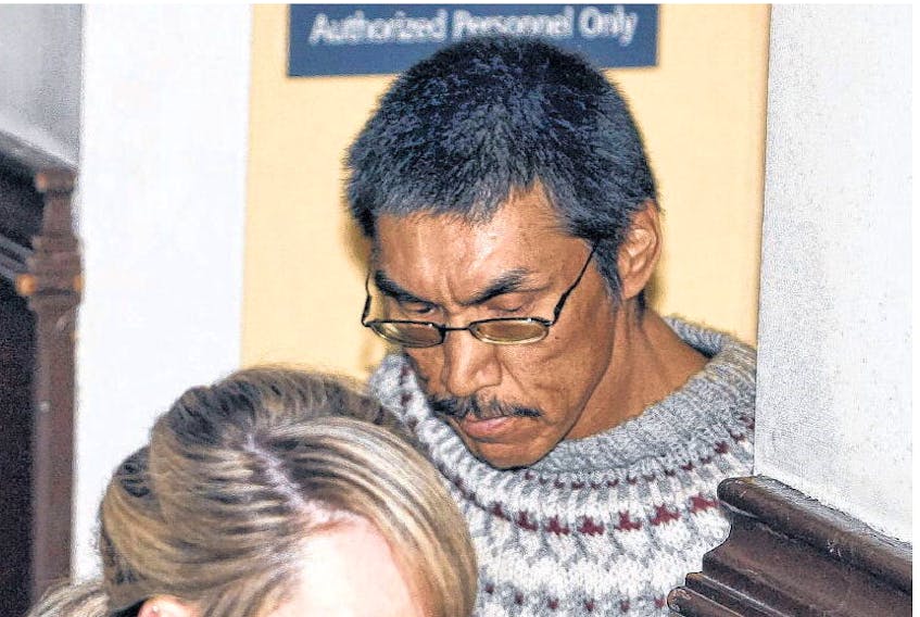 Sem Paul Obed is led into Halifax provincial court Monday to face charges in connection with a sexual assault on a woman Friday. THE CHRONICLE HERALD