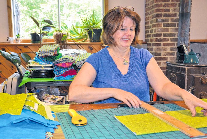 Sandra MacDonald of Rines Creek measures fabric to create her beeswax food wraps.
FRANCIS CAMPBELL • THE CHRONICLE HERALD