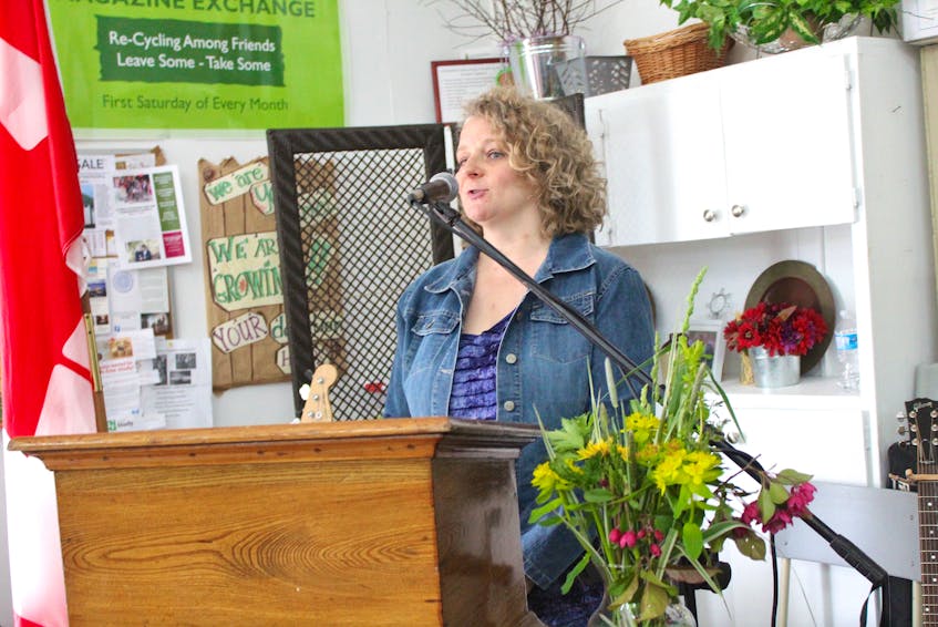 Market manager Pauline Singer speaks to a crowd gathered Saturday at the Cape Breton Farmers' Market. The not-for-profit co-operation has announced it will move to the former Smooth Herman's location with help from a nearly $1-million renovation contribution from the federal government.