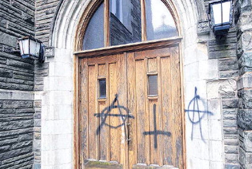Vandals spray painted anarchy symbols on St. Theresa’s Catholic Church on North Street.