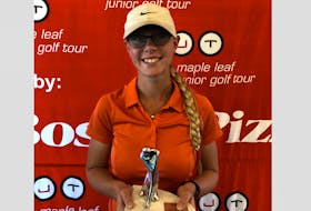 Meghan McLean of Port Williams shows off her trophy after winning the MJT Collegiate Girls age 19-23 division at Ken-Wo recently.