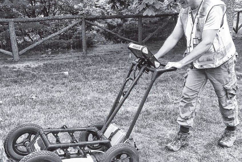 Jonathan Fowler, professor of archeology at Saint Mary’s University, uses ground-penetrating radar to search for the foundation of a Victorian skating rink that used to be located in the Public Gardens. STUART PEDDLE