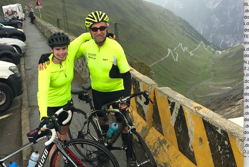 Chris MacDougall of Truro and his niece Meg MacDougall of Halifax take a moment to celebrate their successful cycle to the summit of the Stelvio Pass of the Eastern Alps in Northern Italy during a recent fundraising expedition to raise money for cancer research.