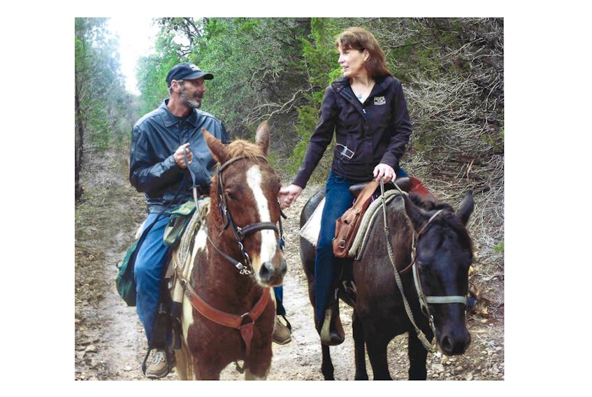 Reid Patterson and Hope Swinimer enjoy some time on horseback.