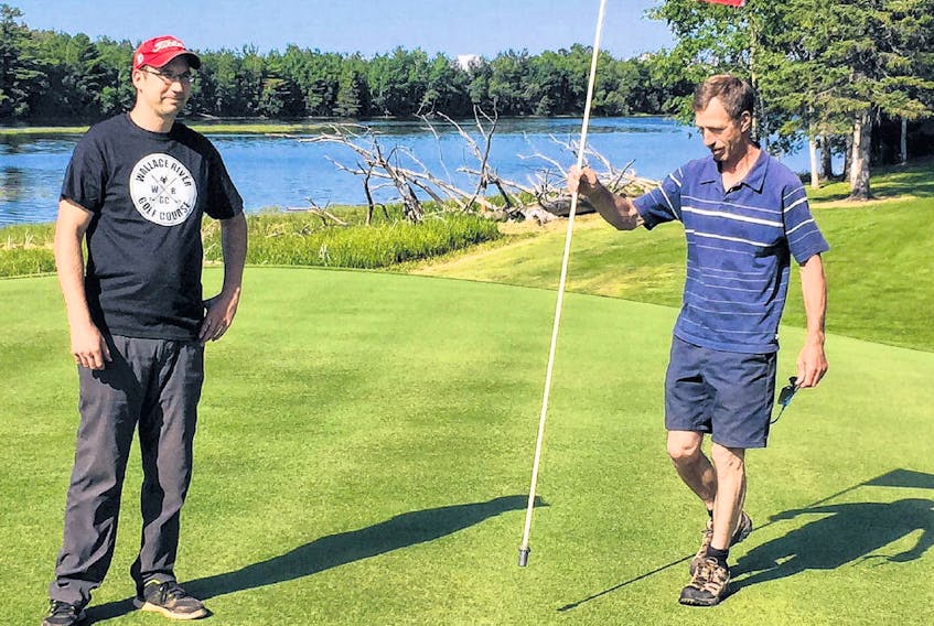 Al Weeks, left, and his father Ron, spent 17 years building, designing and perfecting the Wallace River golf course. Ron Weeks is self-taught in golf course design, and his Wallace River course has several holes fronting on the river.