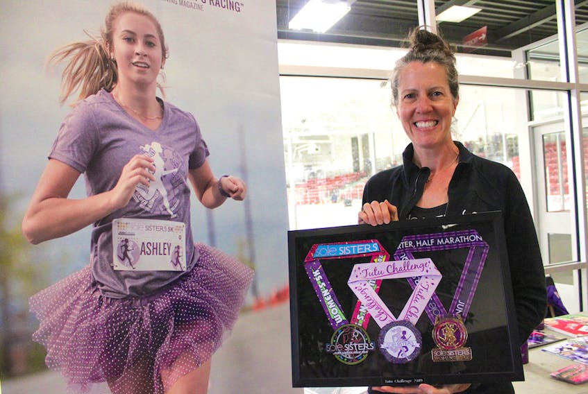 Stacey Chesnutt Active Living Expo – Stacy Chesnutt delivered a presentation on the history of women’s distance running during the 8th annual CBRM Active Living Expo held Saturday in Membertou. Chesnutt, the race director for the Sole Sisters series in Dartmouth, holds onto medals to be won at their next competition in June 2019.