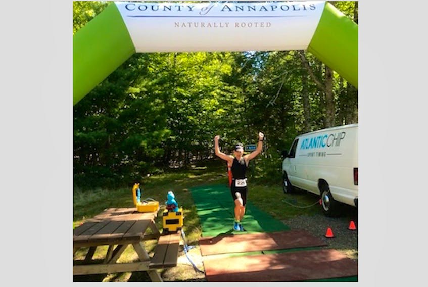 Bryan Hipson of Yarmouth County reaching the finish line of the Keji triathlon Sept. 23. He was first overall in a field of 30 participants.