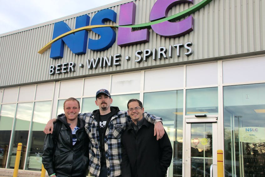 Wanting to ensure they’d be able to purchase cannabis Wednesday morning three Truro residents, from left, Morton Doughty, Jon Richard and Matt Gayle showed up early. They were surprised to discover they were the first in the queue.