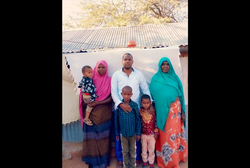 The Iye family in front of their home inside the Dadaab Refugee Camp. From left: “Zaki,” age one, Nimo, Ibrahim, Maryan, Zuheyb, age five and Farhan, age seven.