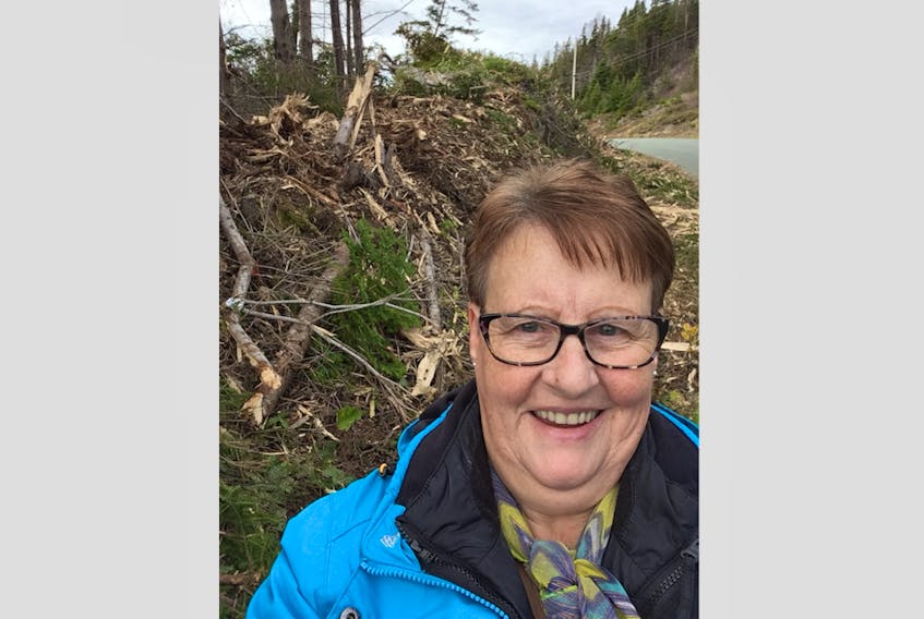 Shirley Greenham of Indian Cove, along route 340, says left over debris from brush cutting along the highway has her town looking “deplorable.”