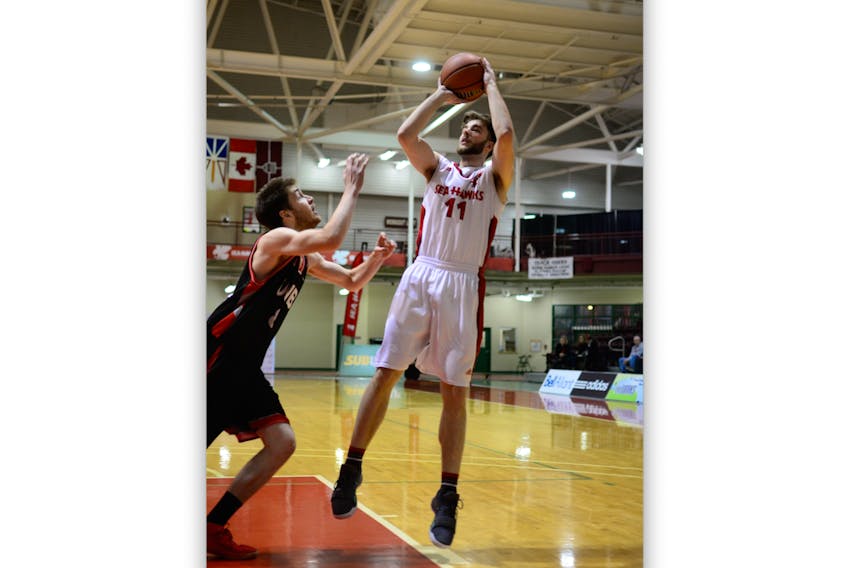The Memorial Sea-Hawks’ Nathan Barker (11), shown letting off a shot against the UNB Varsity Reds at the Field House in St. John’s over the weekend, is the second-leading scorer in the Atlantic universities men’s basketball conference.