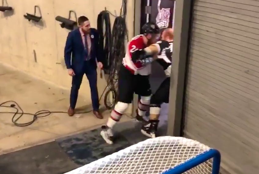 In this screenshot taking from a video posted on Twitter, James Melindy (right) of the Newfoundland Growlers and Mike Folkes of the Brampton Beast fight just outside the Beast dressing room prior to their Sunday afternoon ECHL game in Brampton. The off-ice fight occurred at the end of the pre-game warmup skate. — Twitter/@Michael_J_Lange