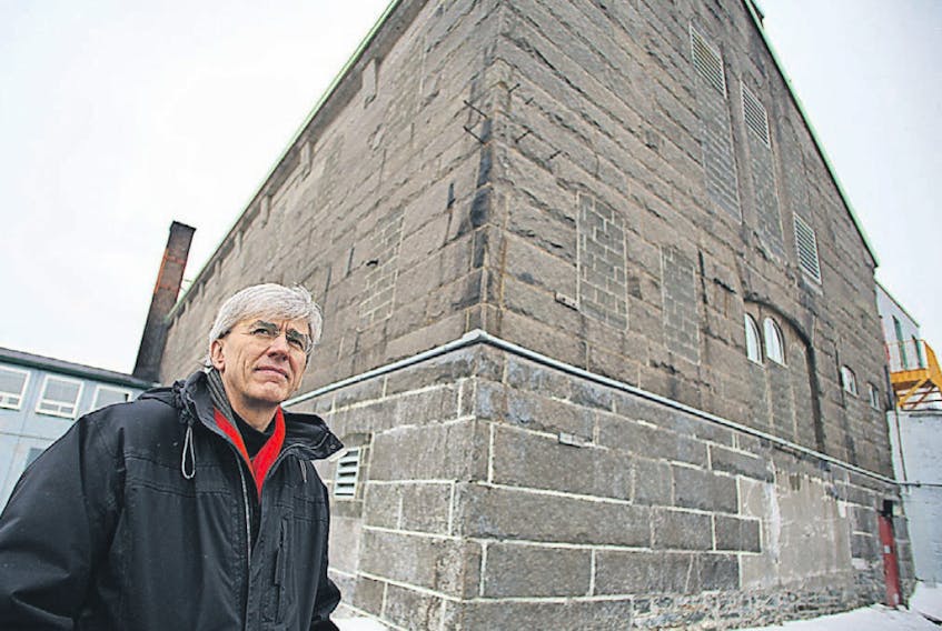 Architect Jim Case stands in front of H.M. Penitentiary Centre Block during a tour of the facility in 2015.