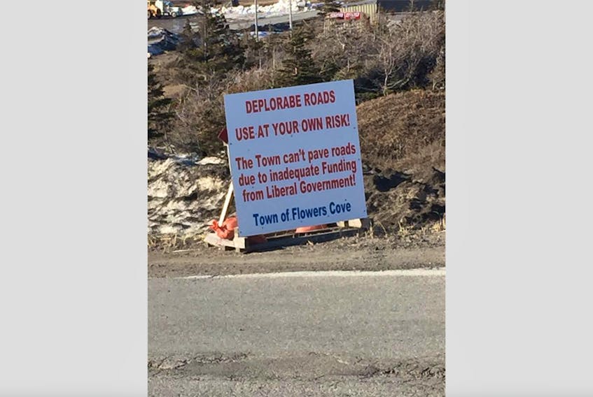 The town council of Flower’s Cove placed this sign along Grenfell Avenue, blaming the Liberal government for the condition of the road.
