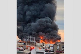 A photo circulating on Facebook shows the Black Duck Cove plant up in flames with black smoke filling the sky.