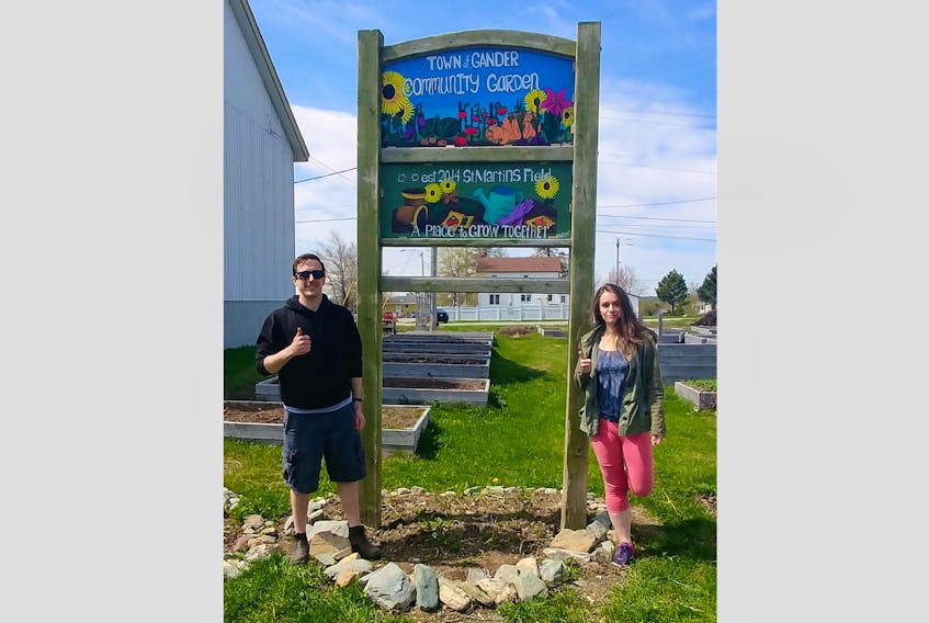 Jordan Lawrence and Melissa Francis are big fans of the community garden. Lawrence is a volunteer and spokesperson for the Gander Community Garden Committee (GCGC). Francis is an artist from Gander Bay who made the new sign for the garden.