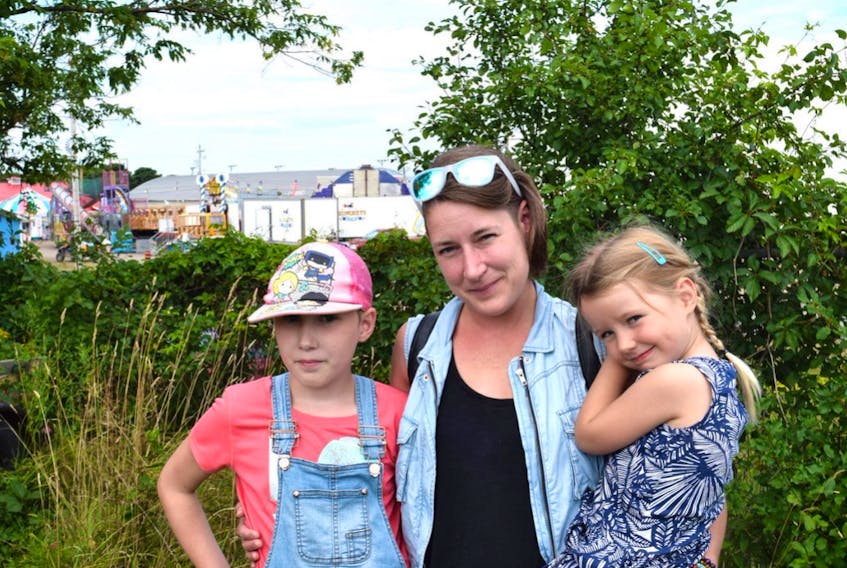 Angela Wyllie of Bible Hill, seen with her daughters Raegan, at left, and Maren, said her experience at the Nova Scotia Provincial Exhibition was less than enjoyable this year because of the second-hand cigarette smoke.