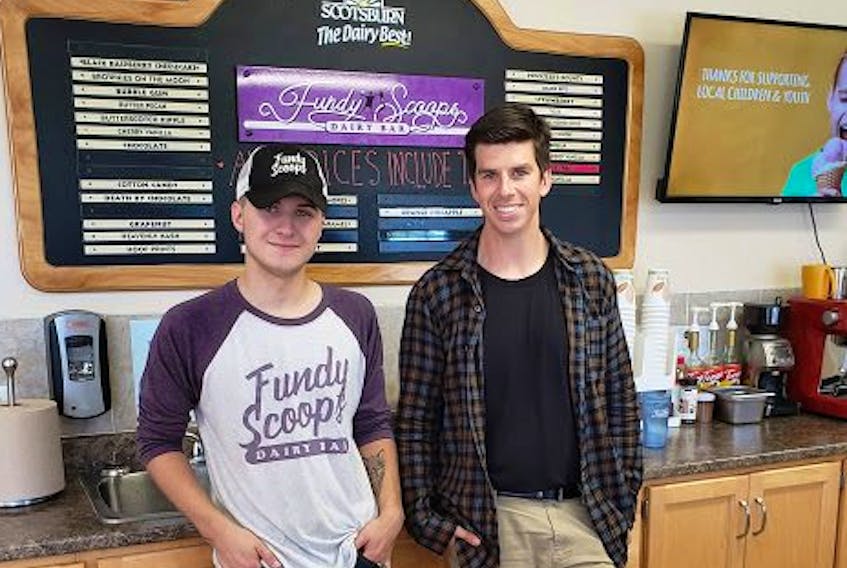 Fundy Scoops Dairy Bar staff member Colin and executive director Nick Sharpe are pleased with how well the summer dairy bar went in North River. The initiative is one of the programs Big Brothers Big Sisters of Colchester offers.