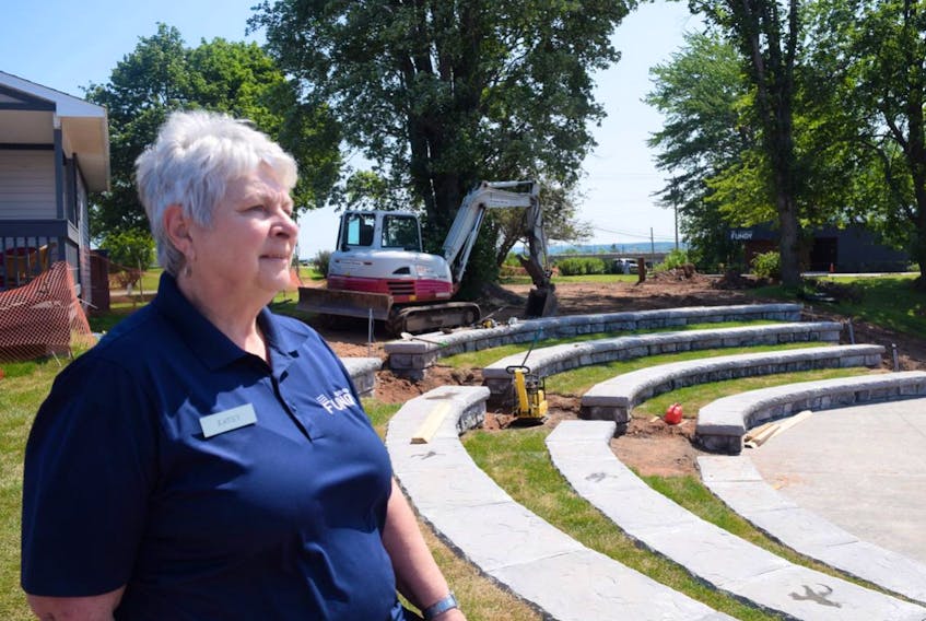Kathy Fisher, manager of the Fundy Discovery Site, with the outdoor ampitheatre.