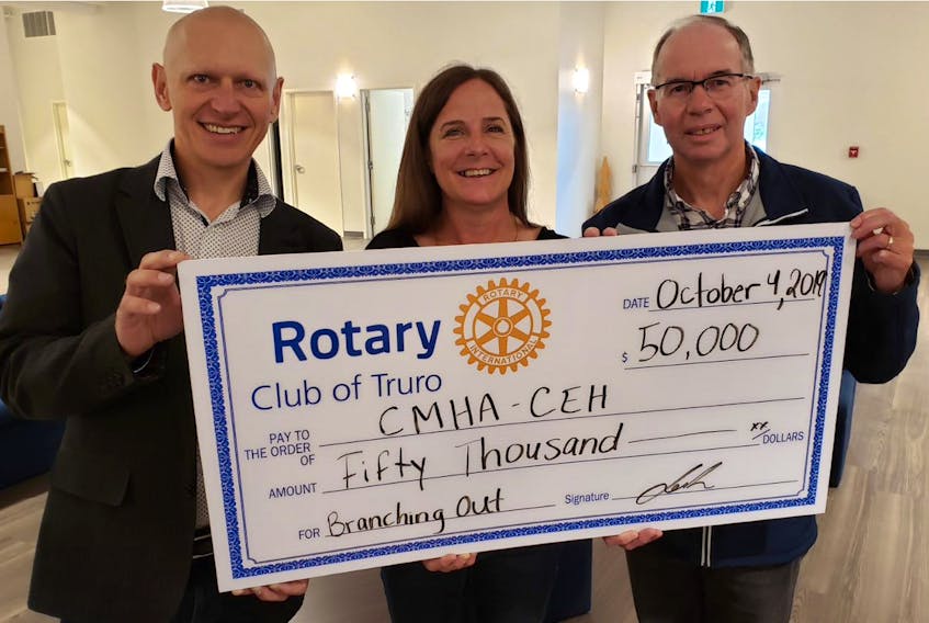 Rotary Club of Truro president Lech Krzywonos, left, executive director of Colchester East Hants branch of the Mental Health Association, Susan Henderson, and Rotarian Ken MacDonald recently gathered for a cheque presentation to CMHA by the local Rotary club.
