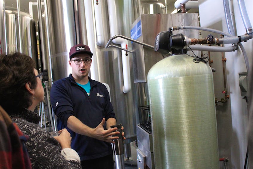 Head brewer at Breton Brewing, Iain Sutherland, explains the water filtration process to the first tour group of the day at the Sydney River facility.