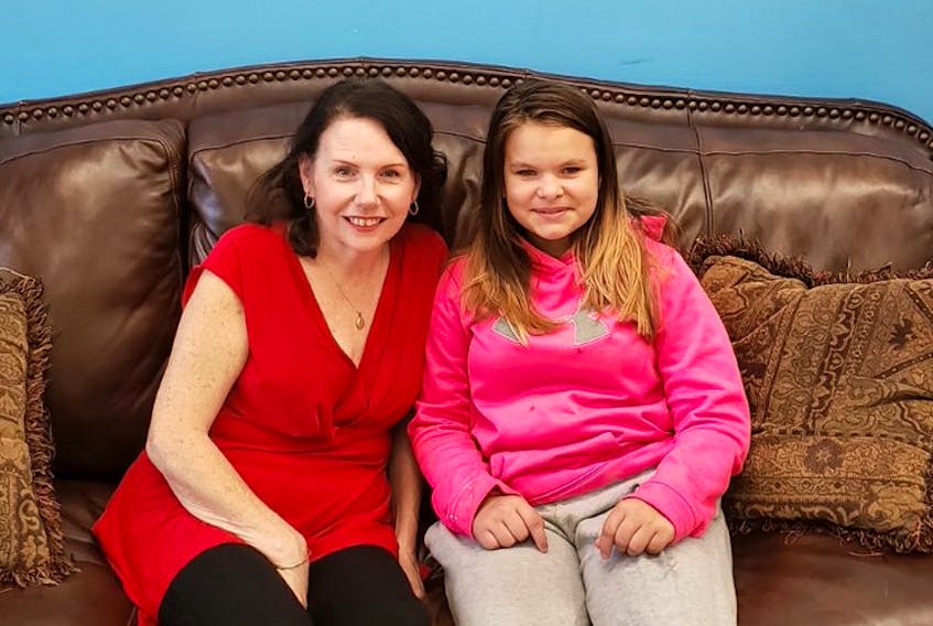 Cathie, left, and Anna share a unique bond through the Big Brothers Big Sisters of Colchester In-School Mentoring Program. The opportunity benefits both youth and adults