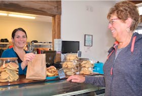 Laurie Burcham, left, owner of Laurie’s Bakeshop on Prince Street in Truro, is seen here with customer Karen O’Toole. Burcham recently received the Truro and Colchester Chamber of Commerce’s Legacy Award.