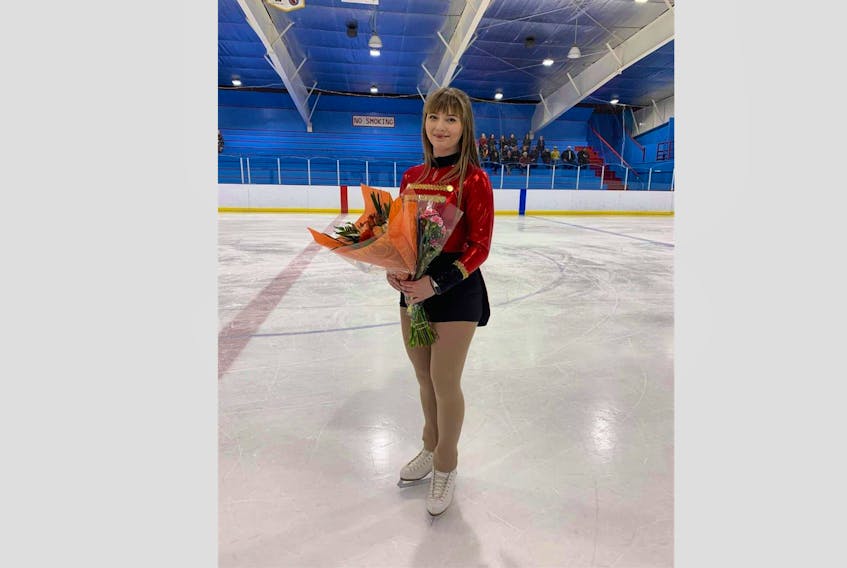 Blaketown figure skater Kyla Russell received roses from her skating club after completing her farewell skate on March 17. Contributed photo