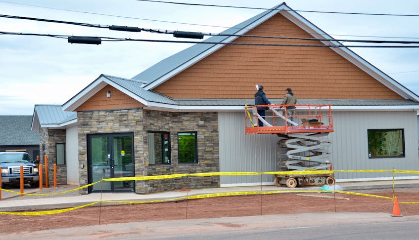 Workers put the final touches on the new Eugene’s General Store in Tignish, which will hold its grand opening on Wednesday.