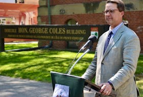 Education Minister Brad Trivers speaks to media outside the Coles Building on Thursday.