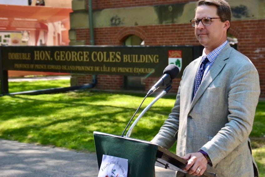 Education Minister Brad Trivers speaks to media outside the Coles Building on Thursday.