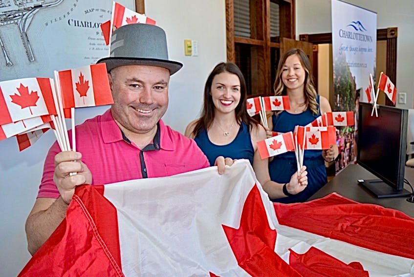 The City of Charlottetown is already into the Canada Day spirit, and even though things are going to be different this year, is hoping that residents will be, too. From left, are Wayne Long, events development officer, Laurel Lea, tourism officer, and Charlotte Nicholson, tourism events co-ordinator.