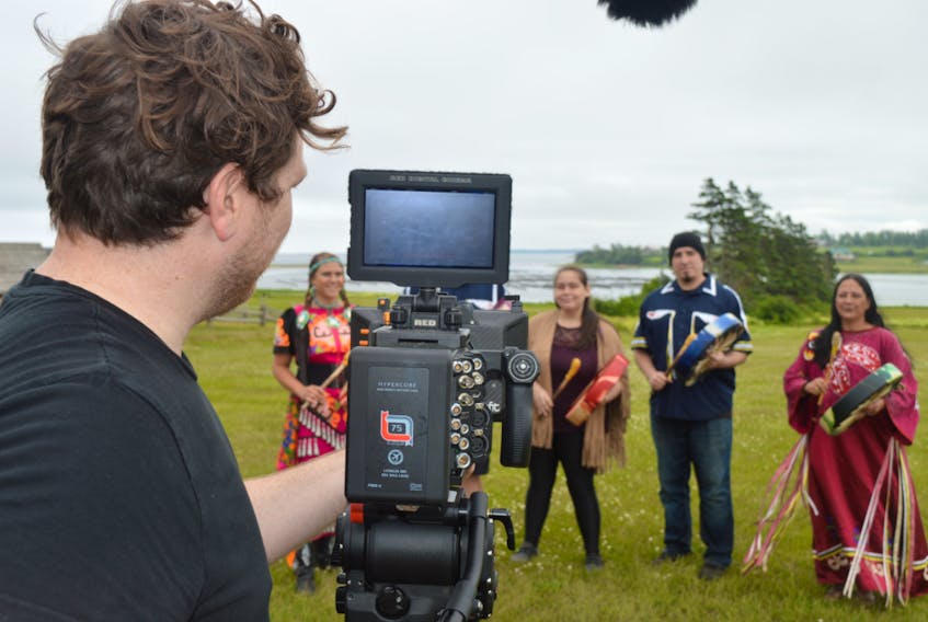 Kyle Simpson, a cameraman with Confound Films, records a performance by the Mi’kmaq Heritage Dancers that will be part of the Island Drive-in Festival this summer.