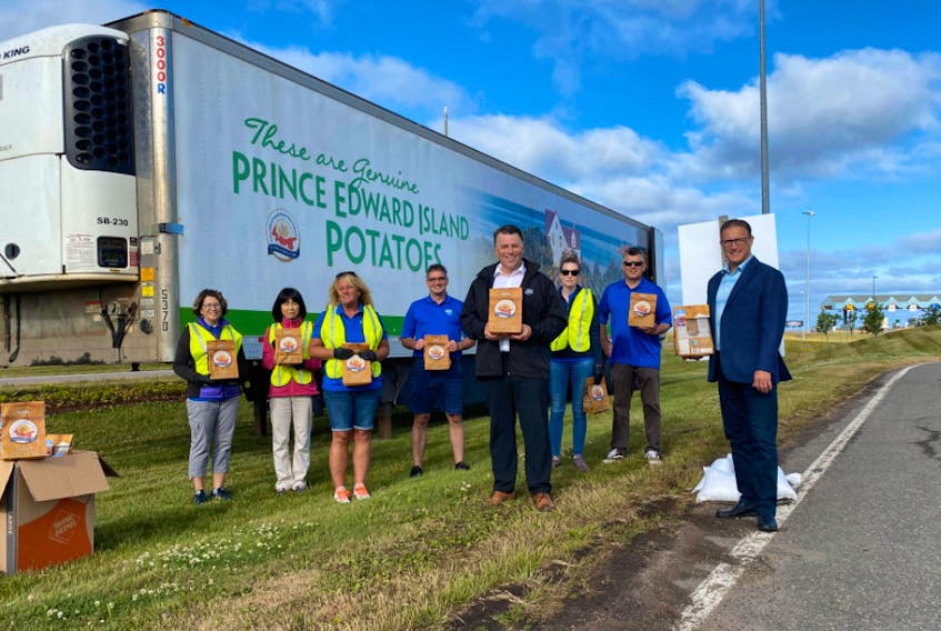Premier Dennis King joined Tourism P.E.I. staff to welcome visitors as they drove off the bridge with a gift of a variety of P.E.I. products to celebrate the opening of the Atlantic Bubble. - Government of P.E.I. Twitter photo
