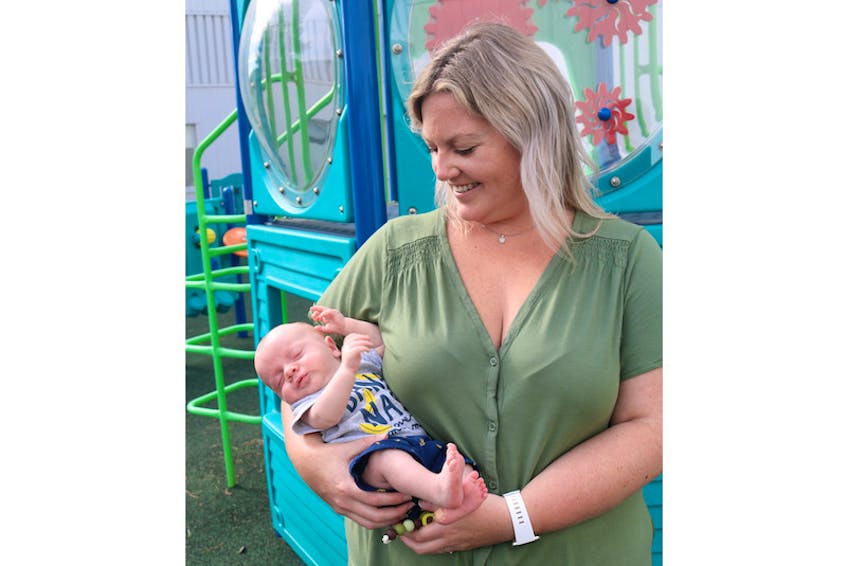 Samantha Wilson poses with her baby Levi in the QEH pediatric playground following a recent check-up. Wilson is thankful for the care Levi received in the NICU after he was born premature and weighing only three-and-a-half pounds.