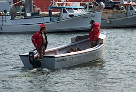 P.E.I. Ground Search and Rescue head out on water from the wharf in Northport Thursday morning. There is an ongoing search for two teen boys who have been missing since last night after their boat capsized.